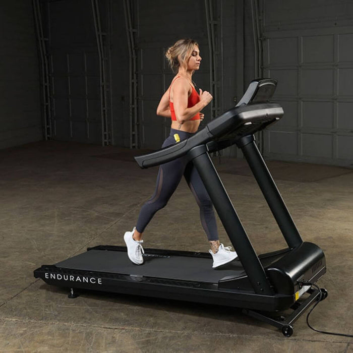 Body-Solid T150 Commercial Treadmill Side View Female Model
