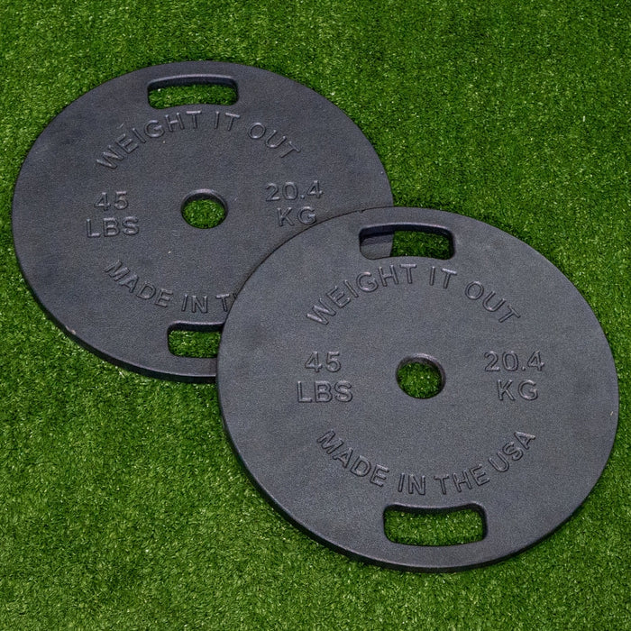 Weight It Out Cast Iron 45lb Black Coated Machined Plates on Turf