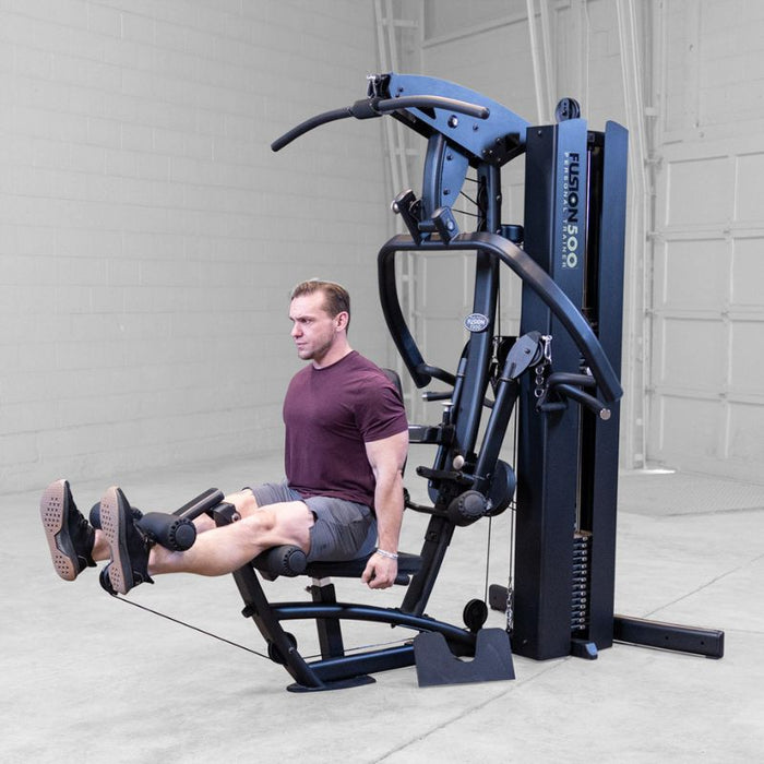 Body-Solid F500/F500B Fusion 500 Modular Single Stack Gym leg extension male demonstration