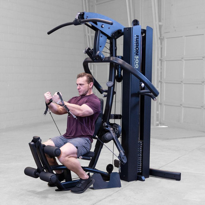 Body-Solid F500/F500B Fusion 500 Modular Single Stack Gym male row training angle view