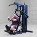Body-Solid F500/F500B Fusion 500 Modular Single Stack Gym male row training angle view