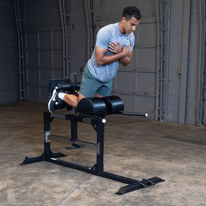 Body-Solid Pro Clubline Glute Ham Developer SGH500B demo man back extension