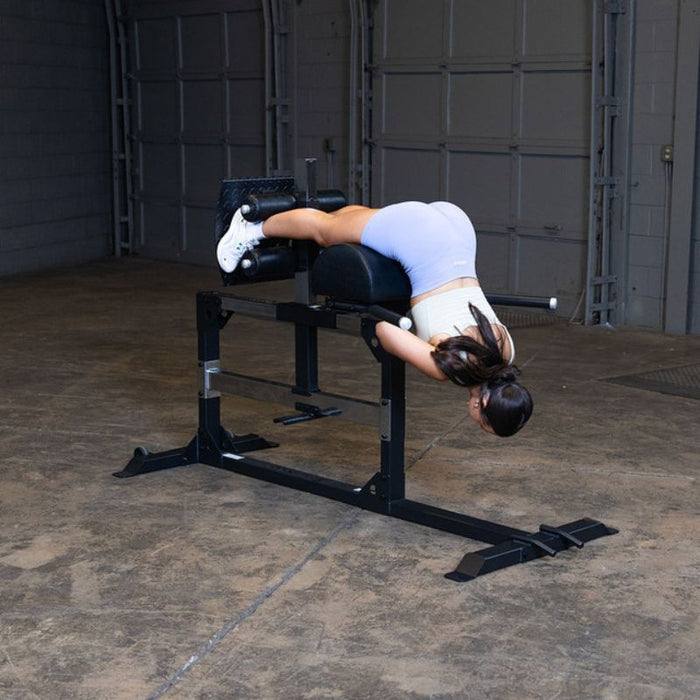 Body-Solid Pro Clubline Glute Ham Developer SGH500B demo woman back extension