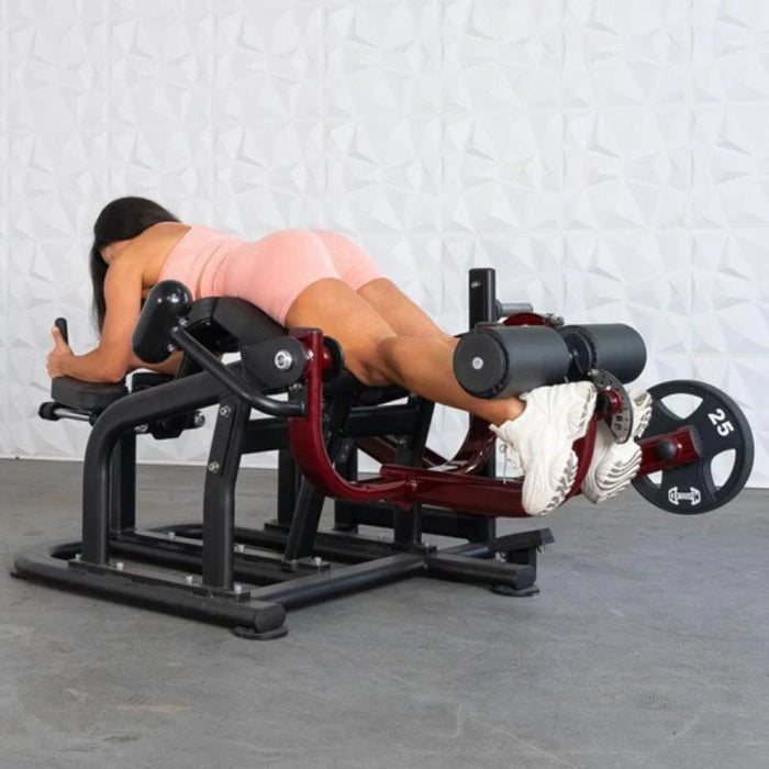 Muscle D Pro Strength Prone Leg Curl female demo extended position