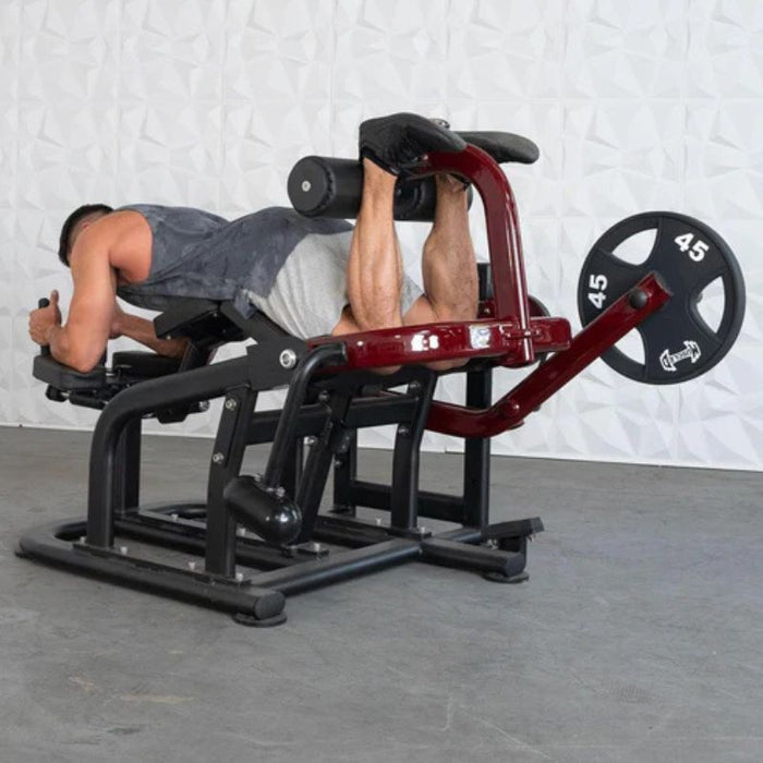 Muscle D Pro Strength Prone Leg Curl male demo top position