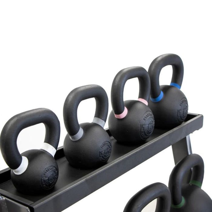 TKO 5-50lb Vinyl Kettlebell Set with 3-Tier Rack closeup top shelf kettlebells