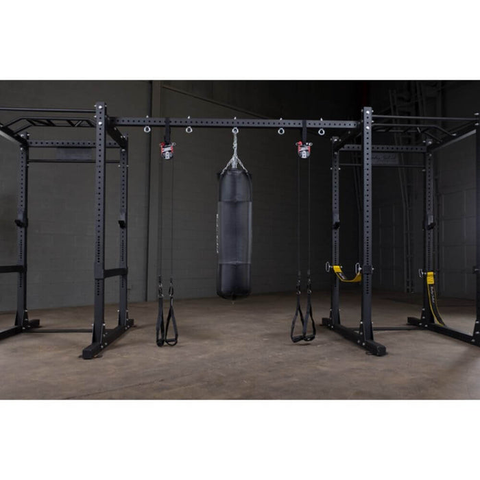 Body-Solid SPRACB Power Rack Connecting Bar Front View With Punching Bag