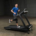 Body-Solid T150 Commercial Treadmill Side View Male Model