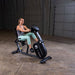Endurance by Body-Solid Recumbent Bike B4RB Side View Facing Right With Female Model